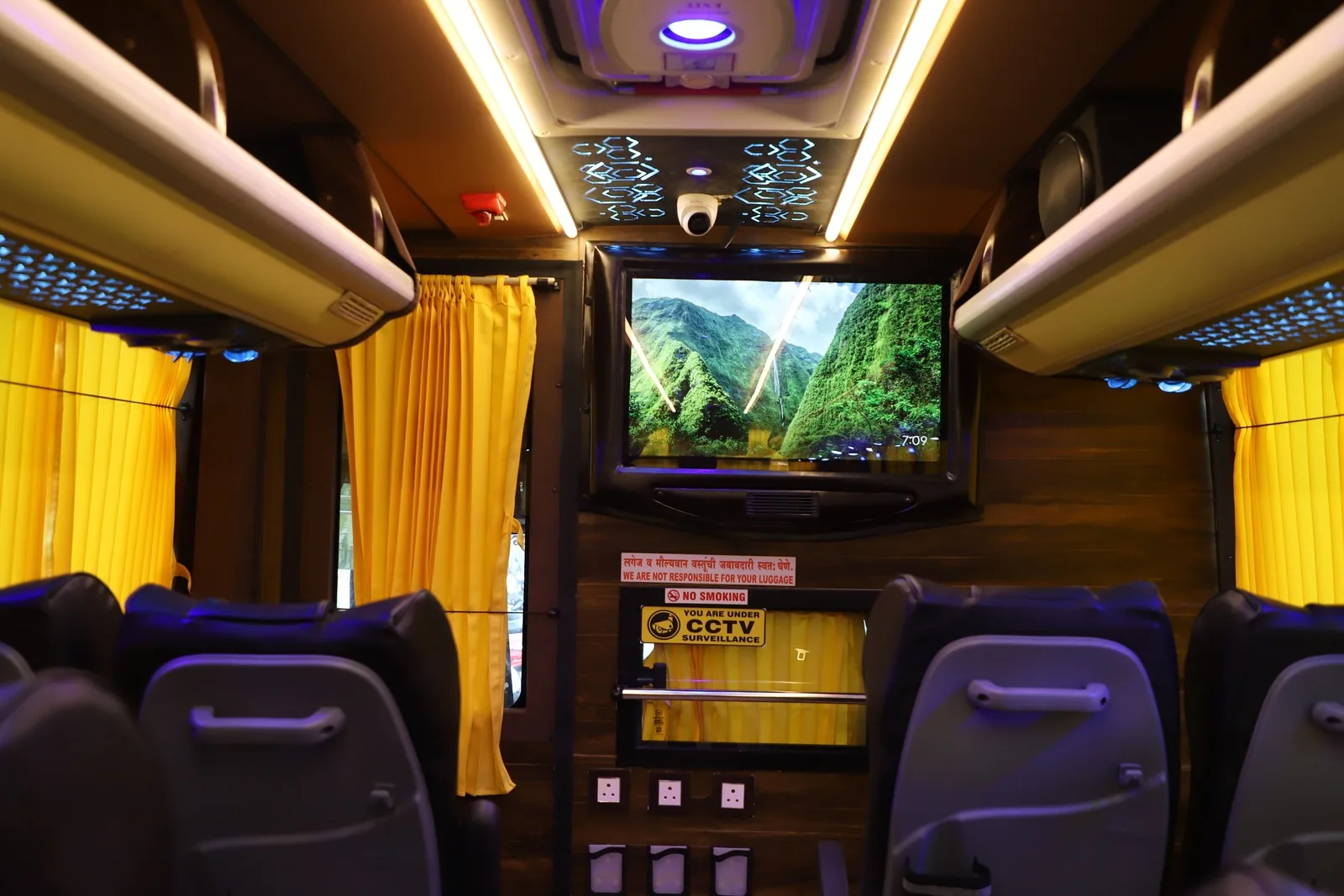 Close-up bus interior view showing TV and CCTV