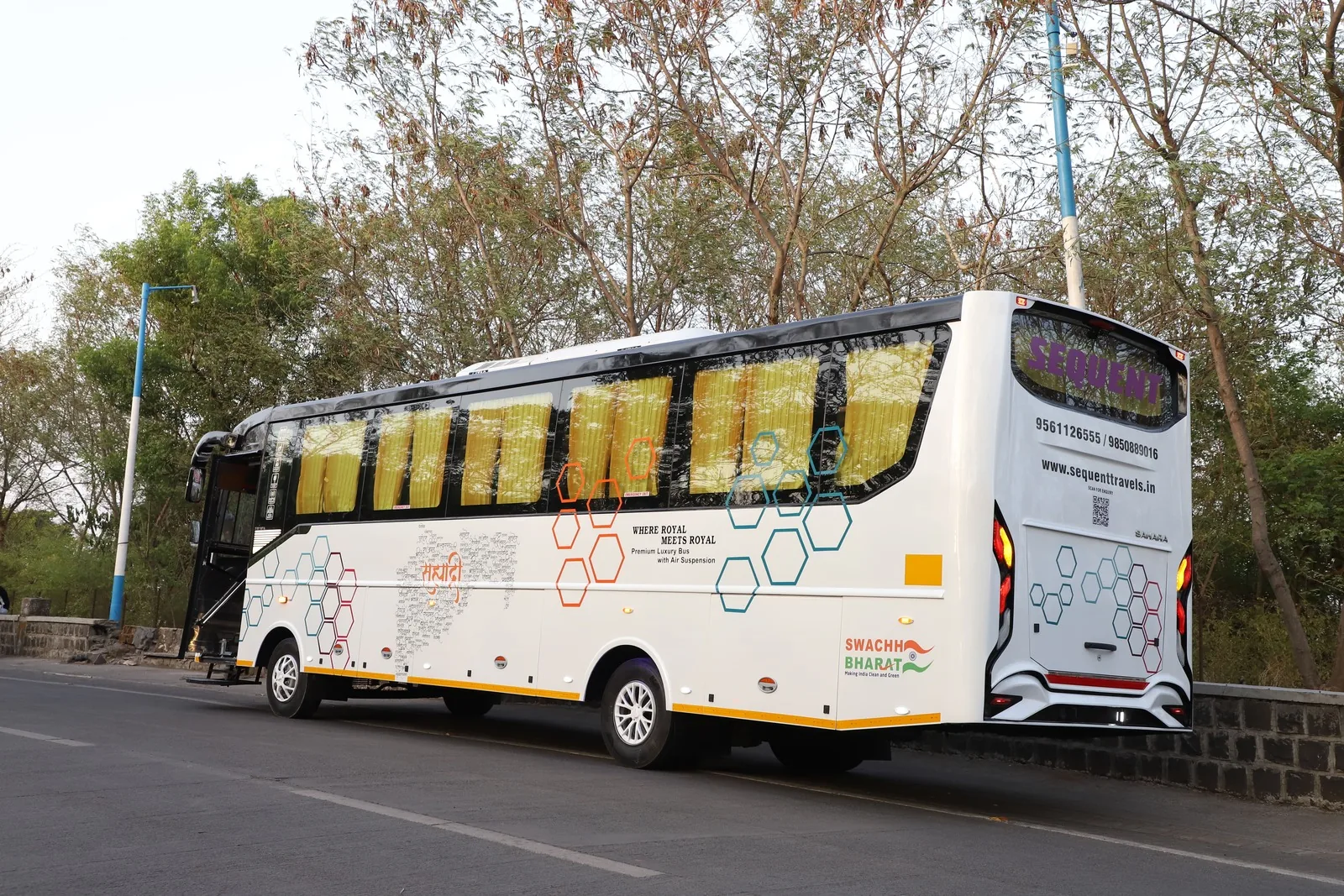 Side exterior view of Sequent Travels bus